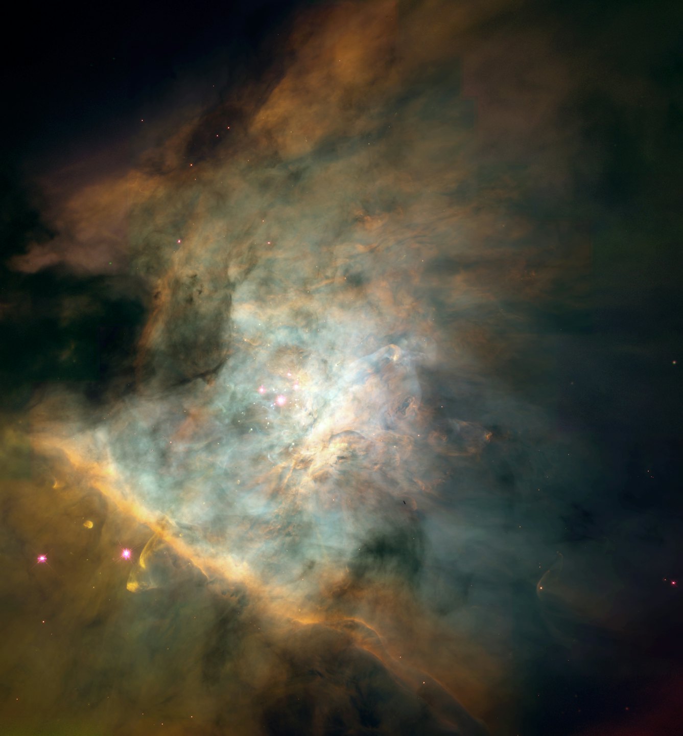 Teal and orange gas clouds swirl around clusters of bright stars.